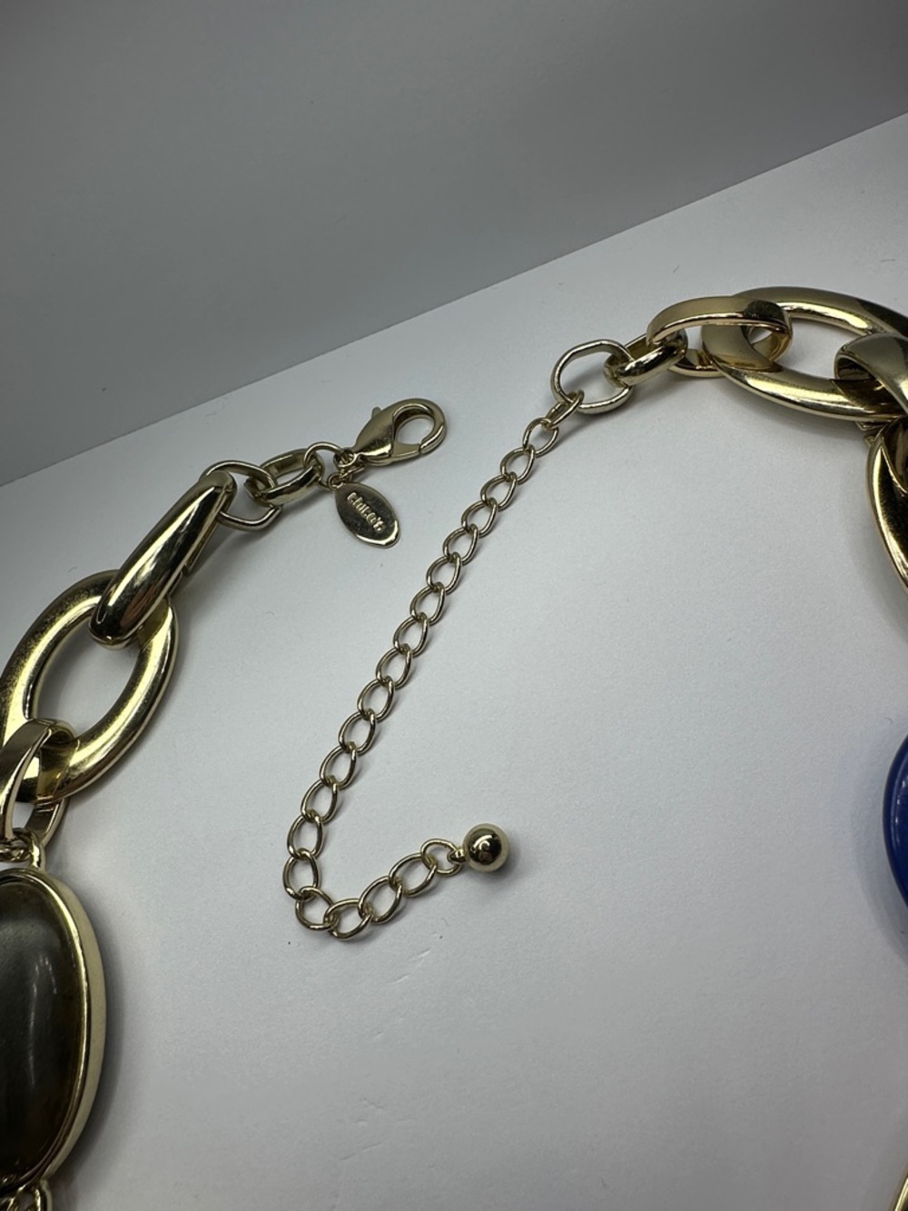 Chico's Gold-Tone Link Necklace with Deep Blue Swirled Lucite Rings - Picture 4 of 5